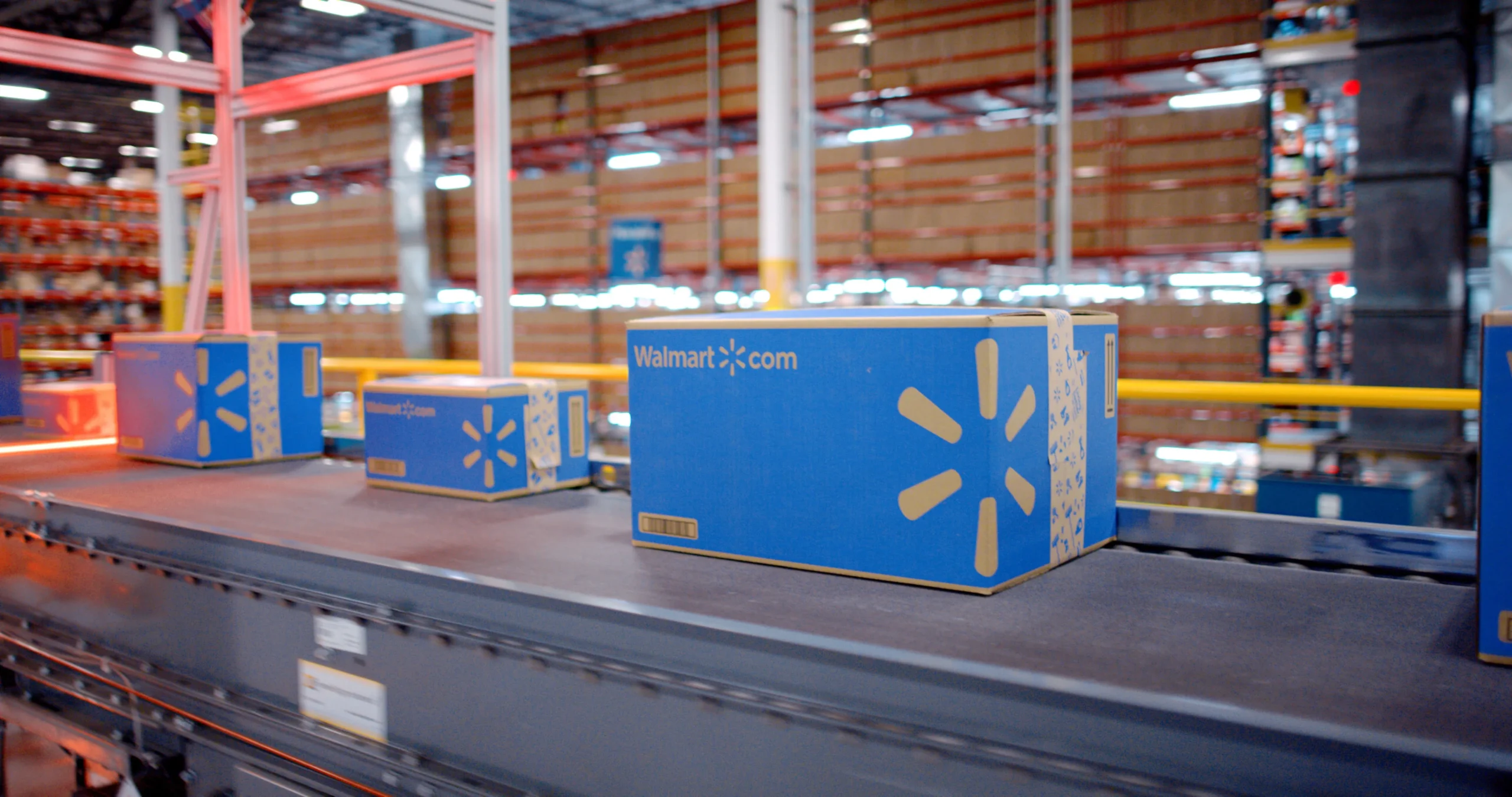 Walmart fulfillment boxes on a warehouse conveyor